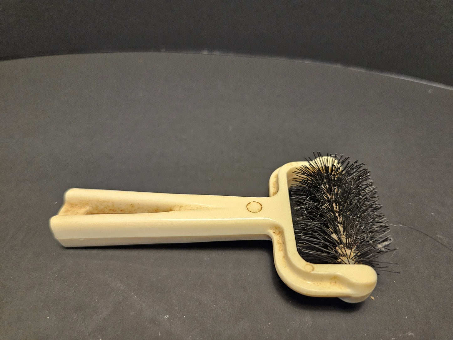 Ivory Plastic Collectible Brush with Black Bristles