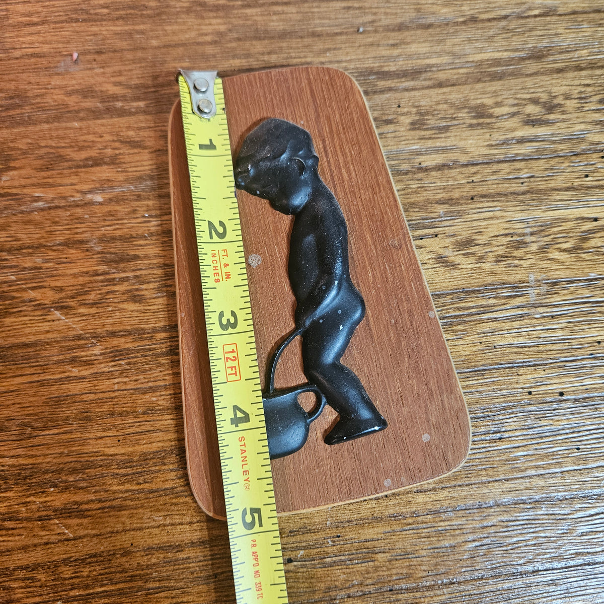 Wood Plaque with Black Figural Boy & Kettle