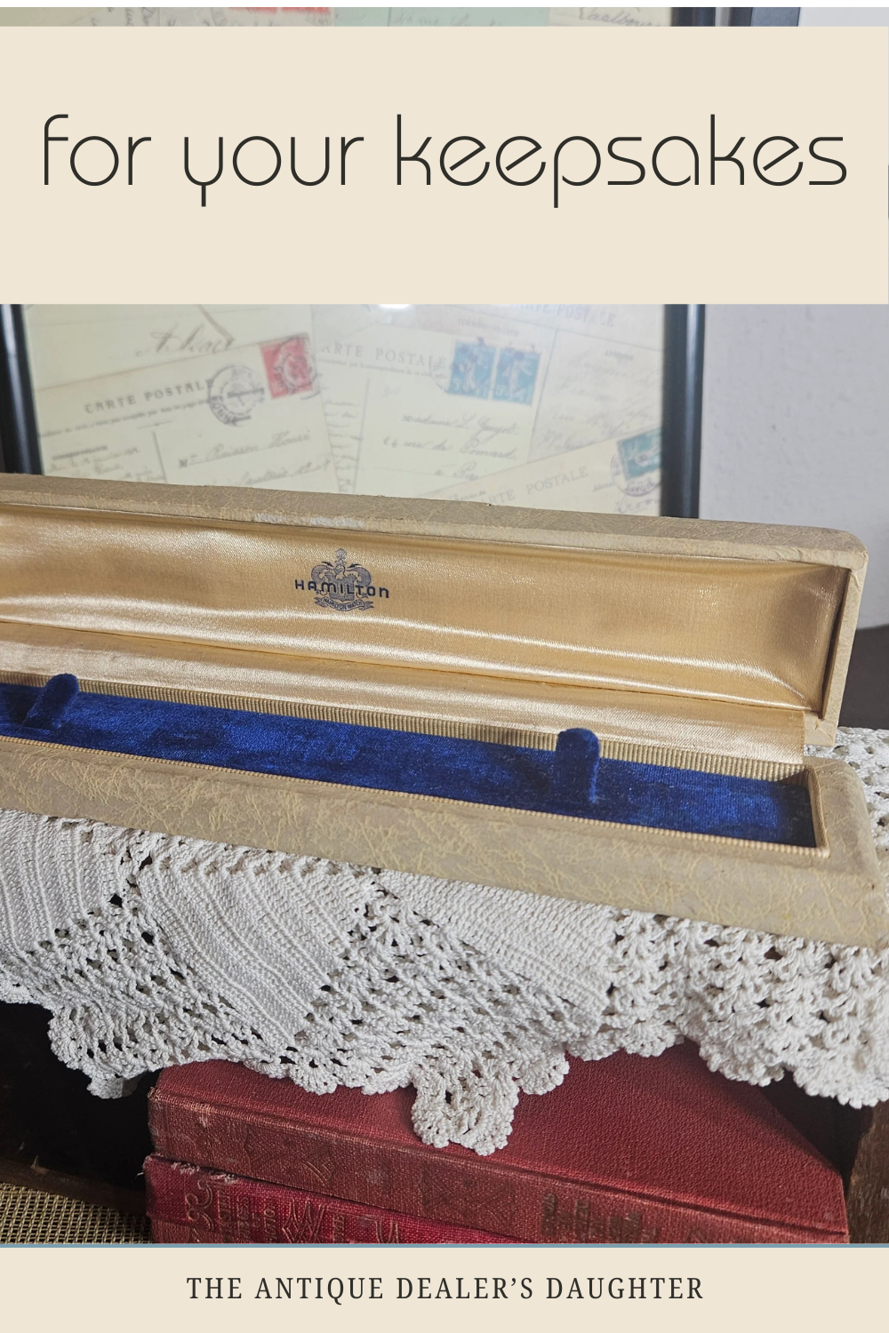 Wooden jewelry box with blue interior on a lace-covered surface, text 'For your keepsakes' above.