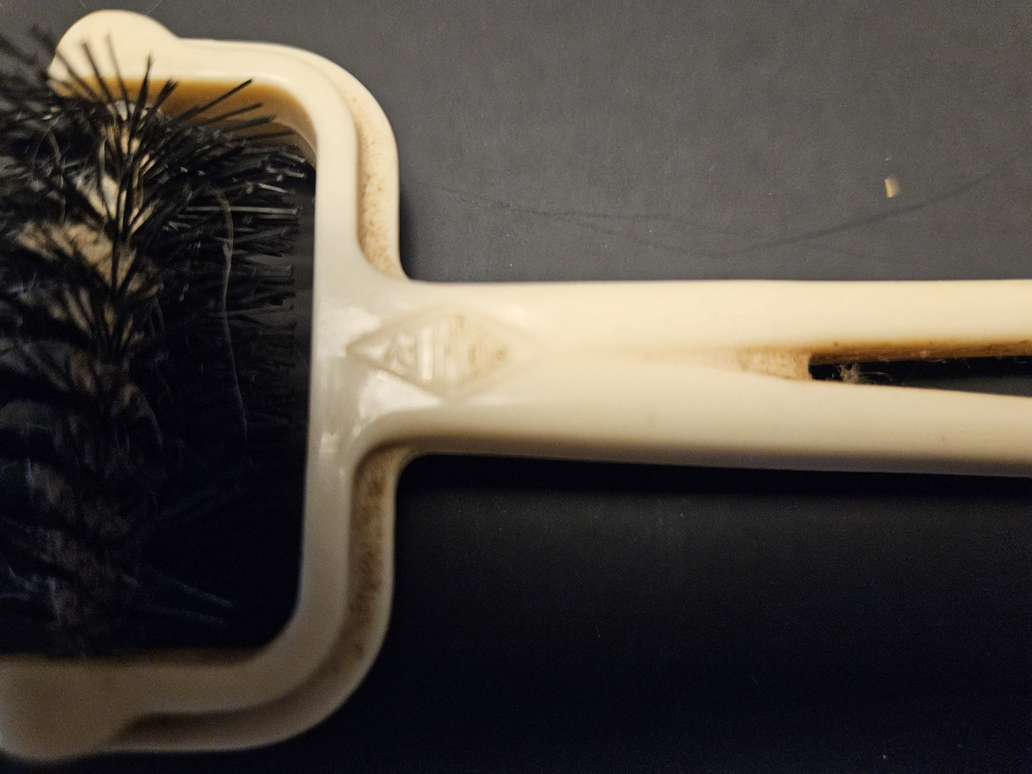 Ivory Plastic Collectible Brush with Black Bristles