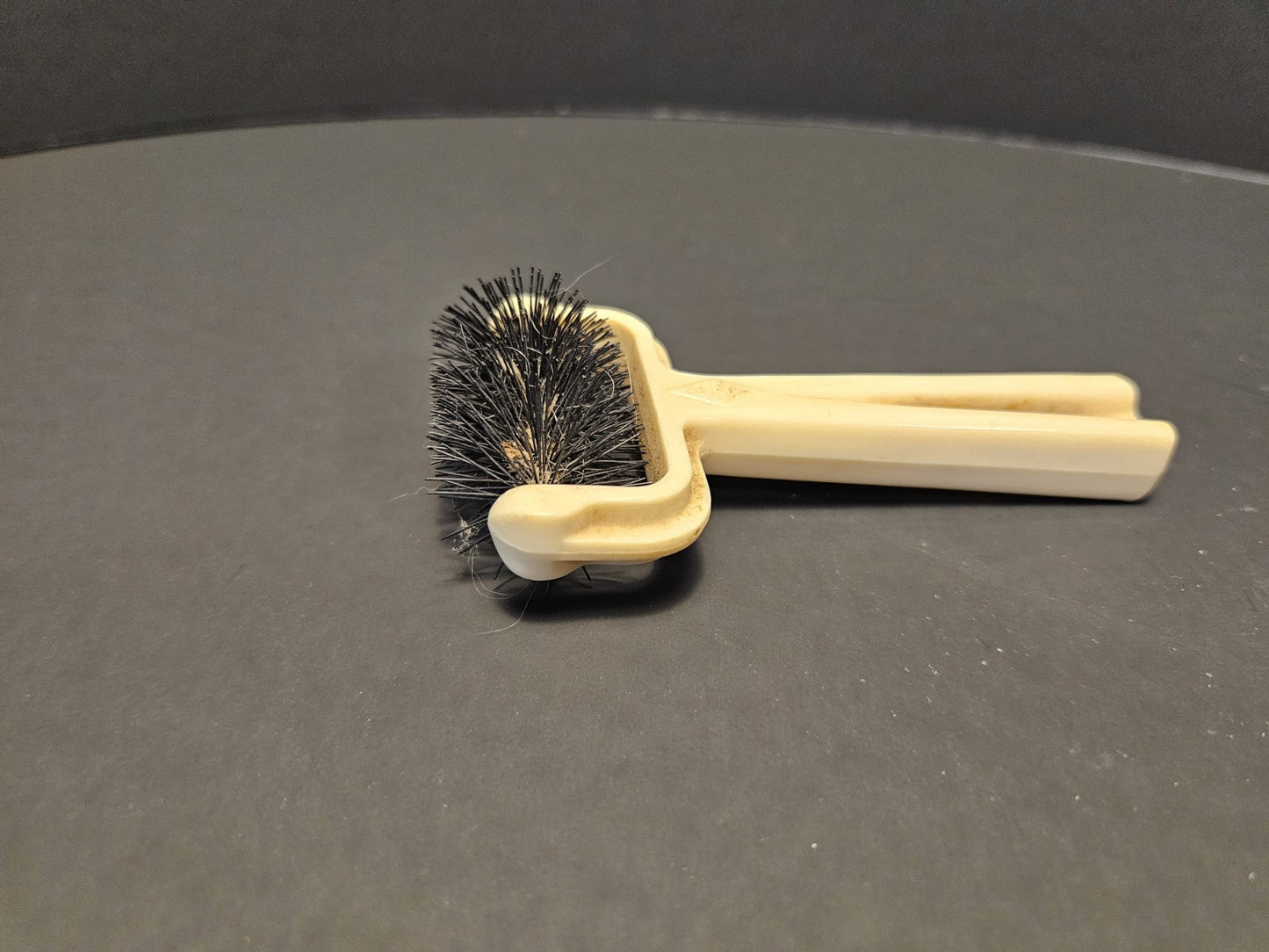 Ivory Plastic Collectible Brush with Black Bristles