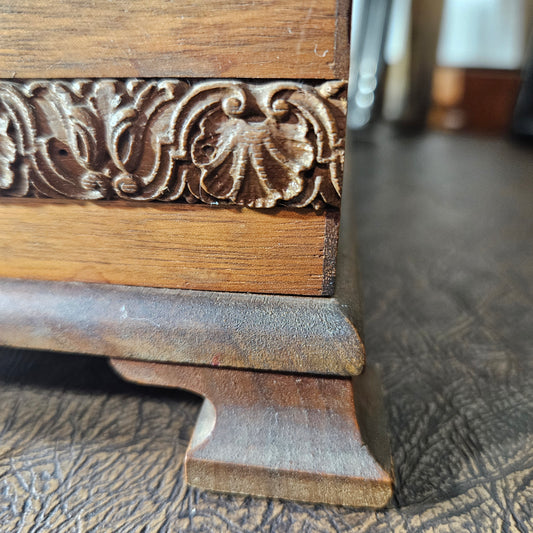 Wooden box leg with intricate carvings 