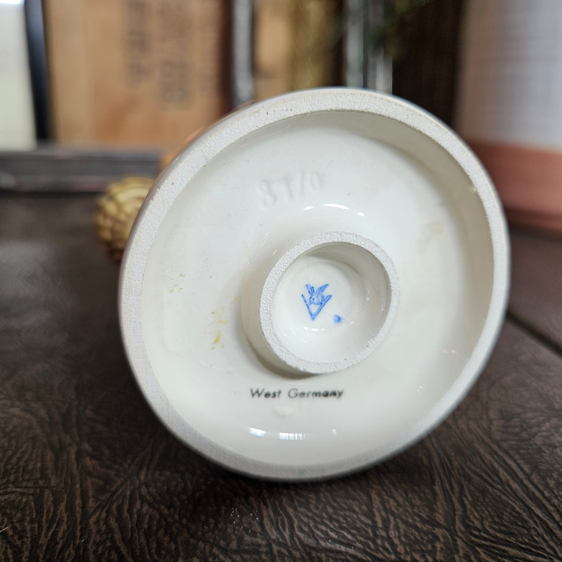 White ceramic item with 'West Germany' text on a textured surface