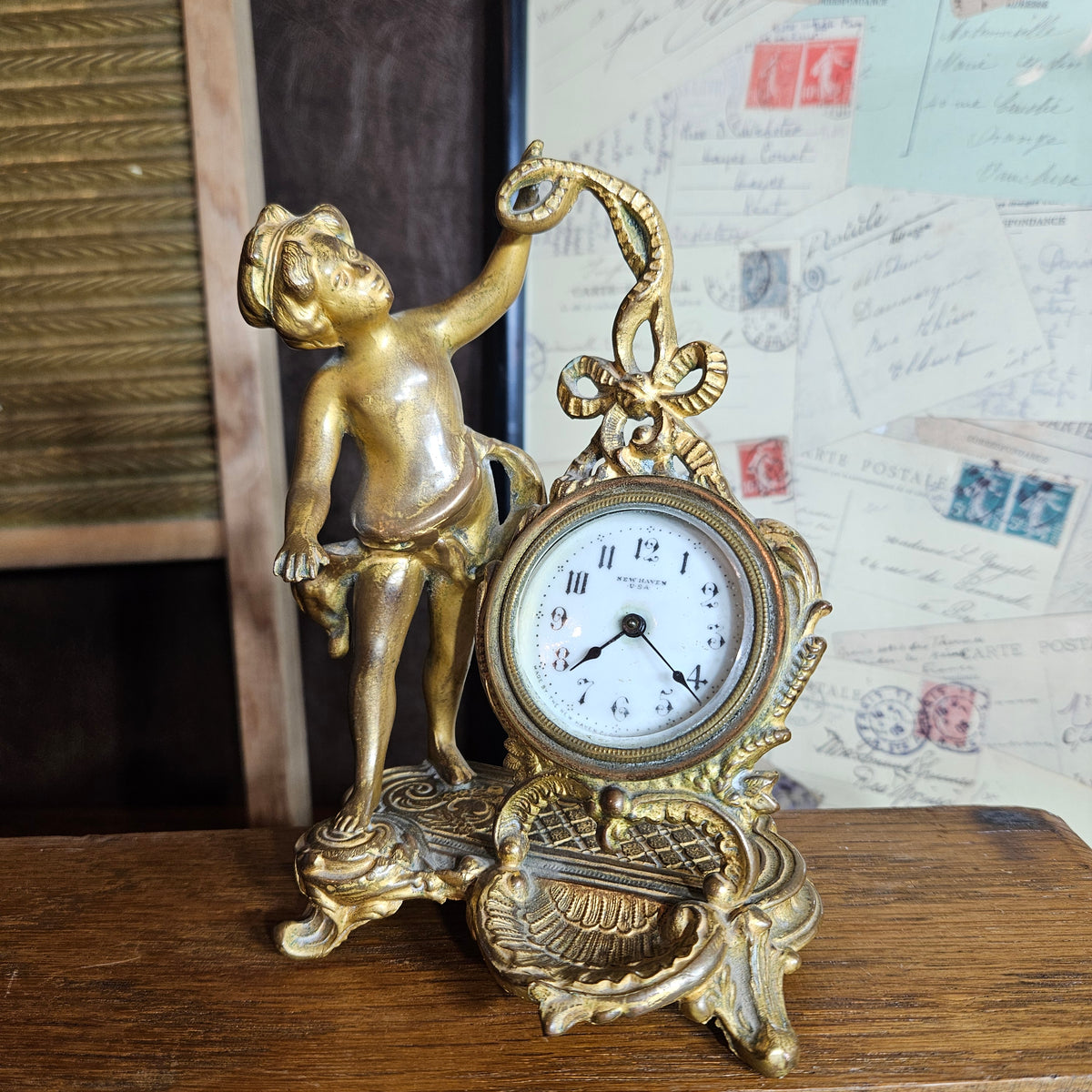 New Haven Cherub Figural Mantel Clock