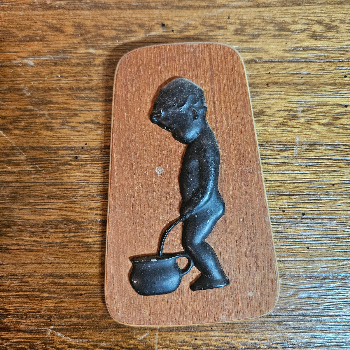 Wood Plaque with Black Figural Boy & Kettle