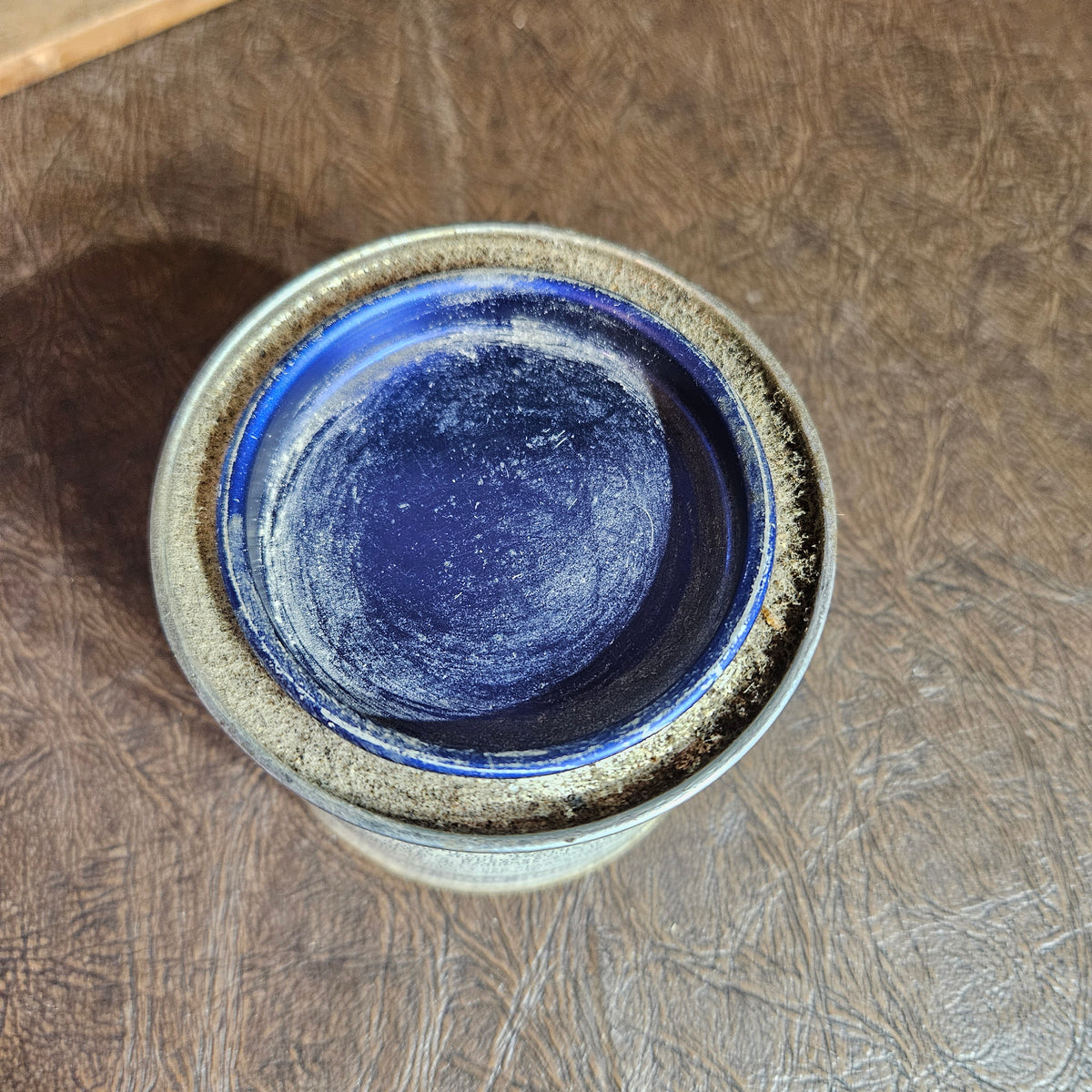 Hubert’s Shoe Grease Advertising Tin with Blue Glass Insert