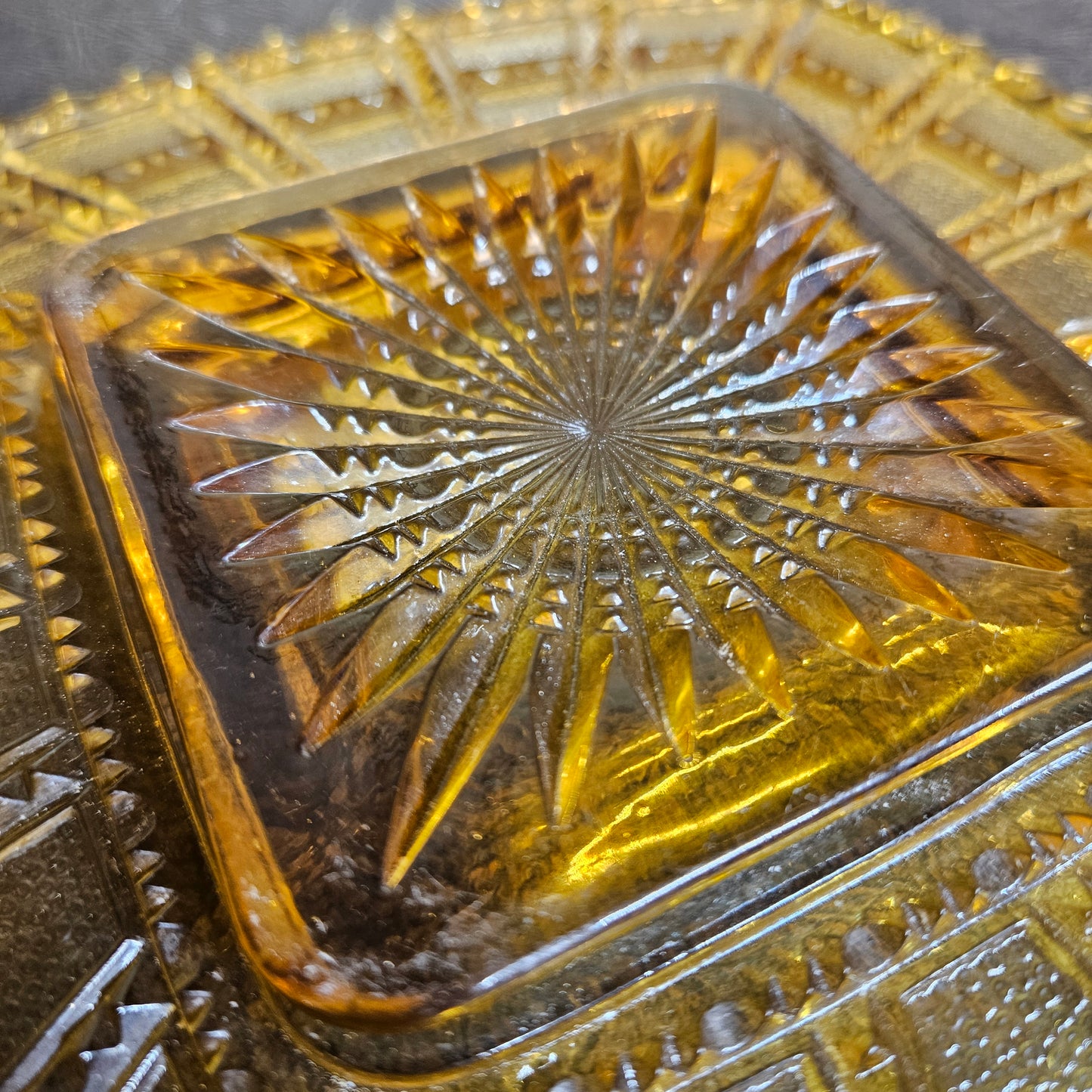 Vintage amber pressed glass bowl starburst pattern pattern detail