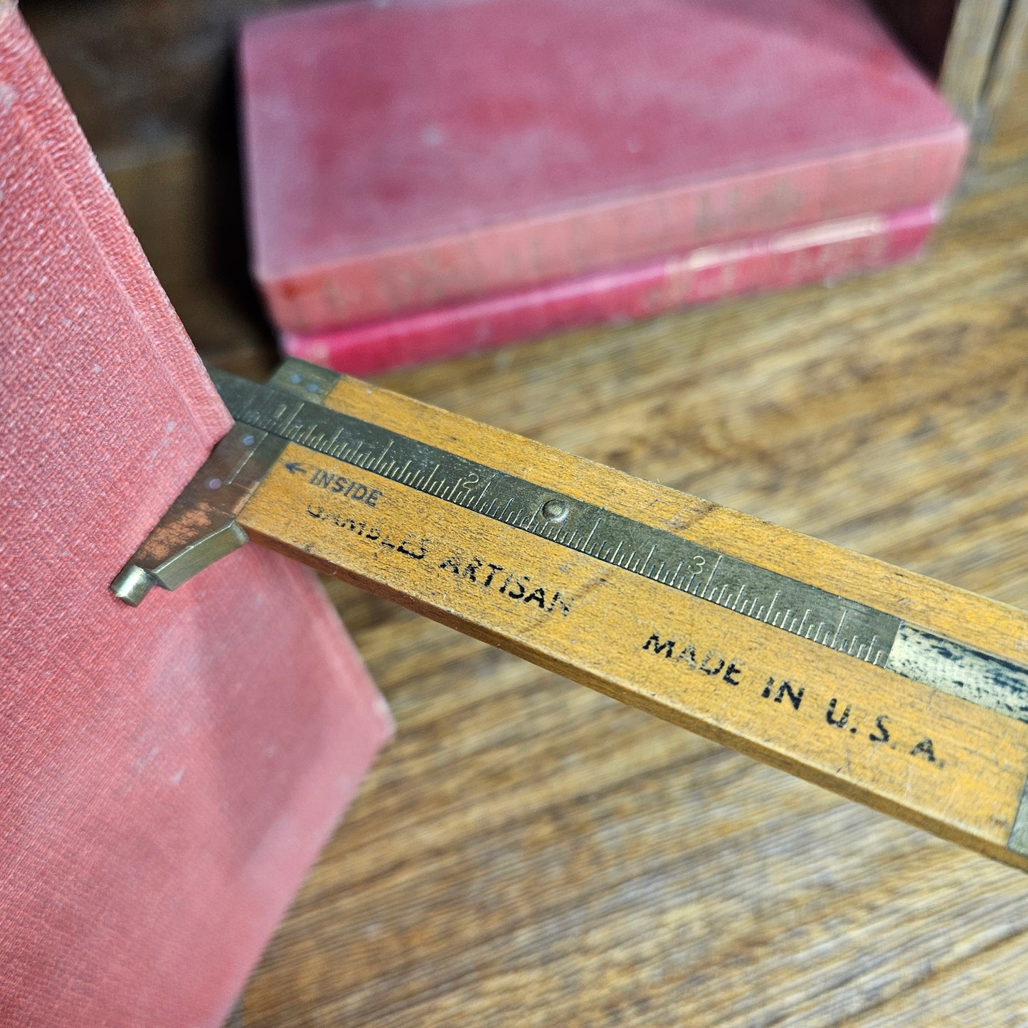 old wooden measuring gauge on wood surface