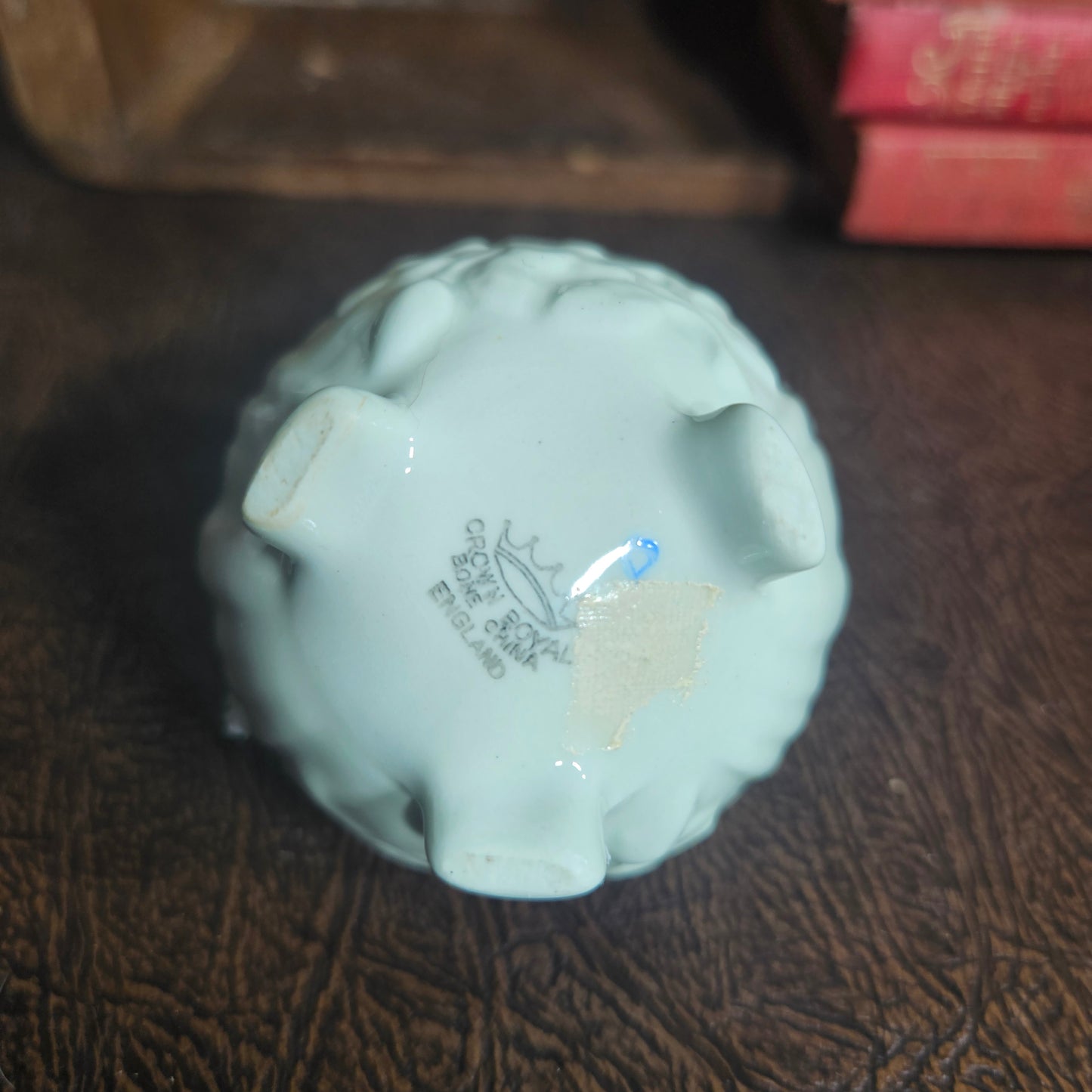 Light blue ceramic figure with 'Crown Royal' England branding 