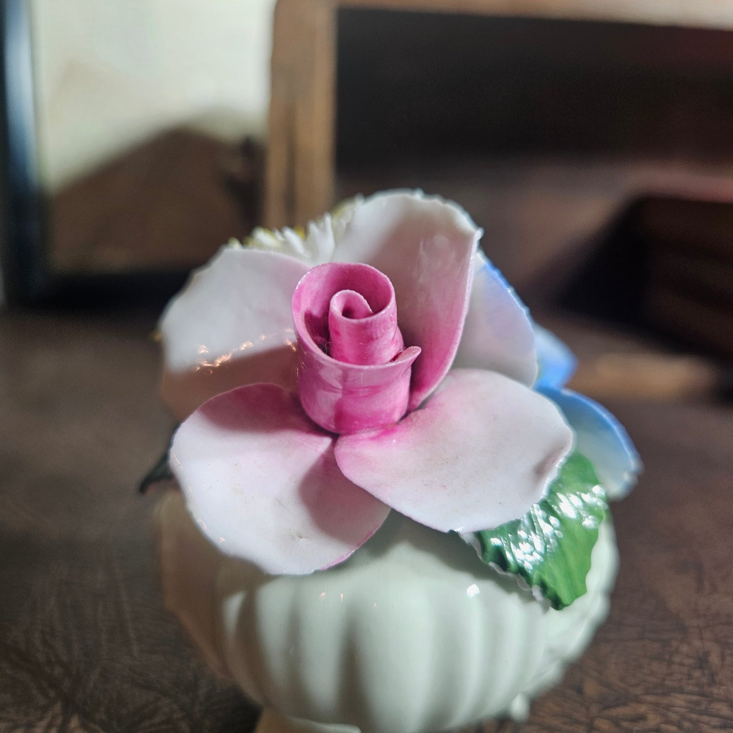 Pink flower on a white ceramic 