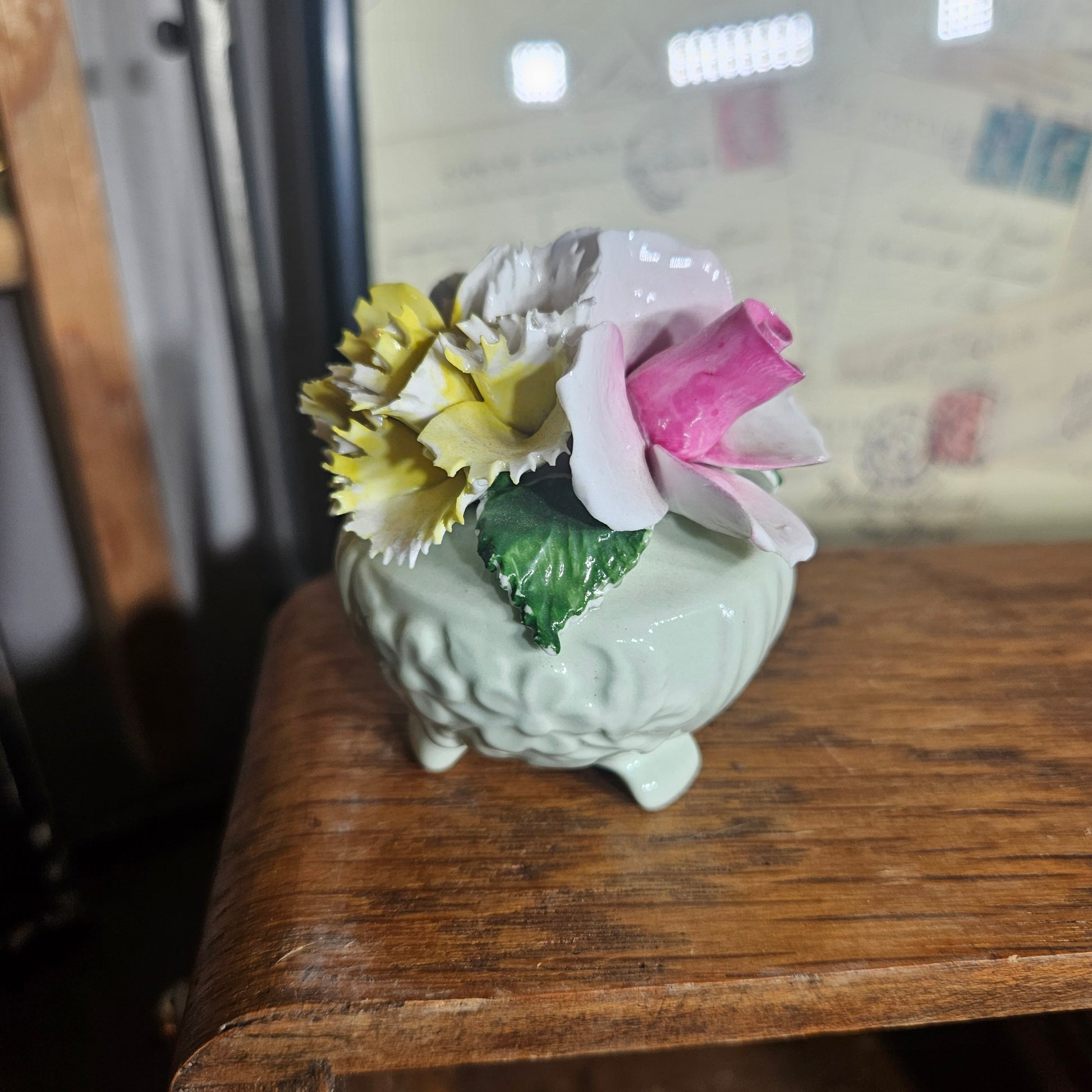 Decorative ceramic item with pink and yellow flowers 