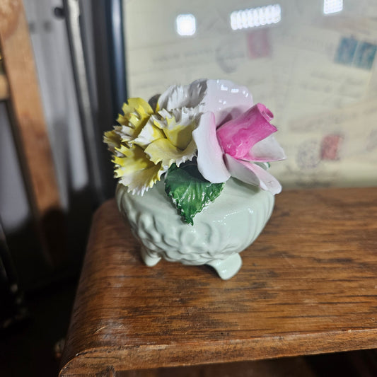 Decorative ceramic item with pink and yellow flowers 