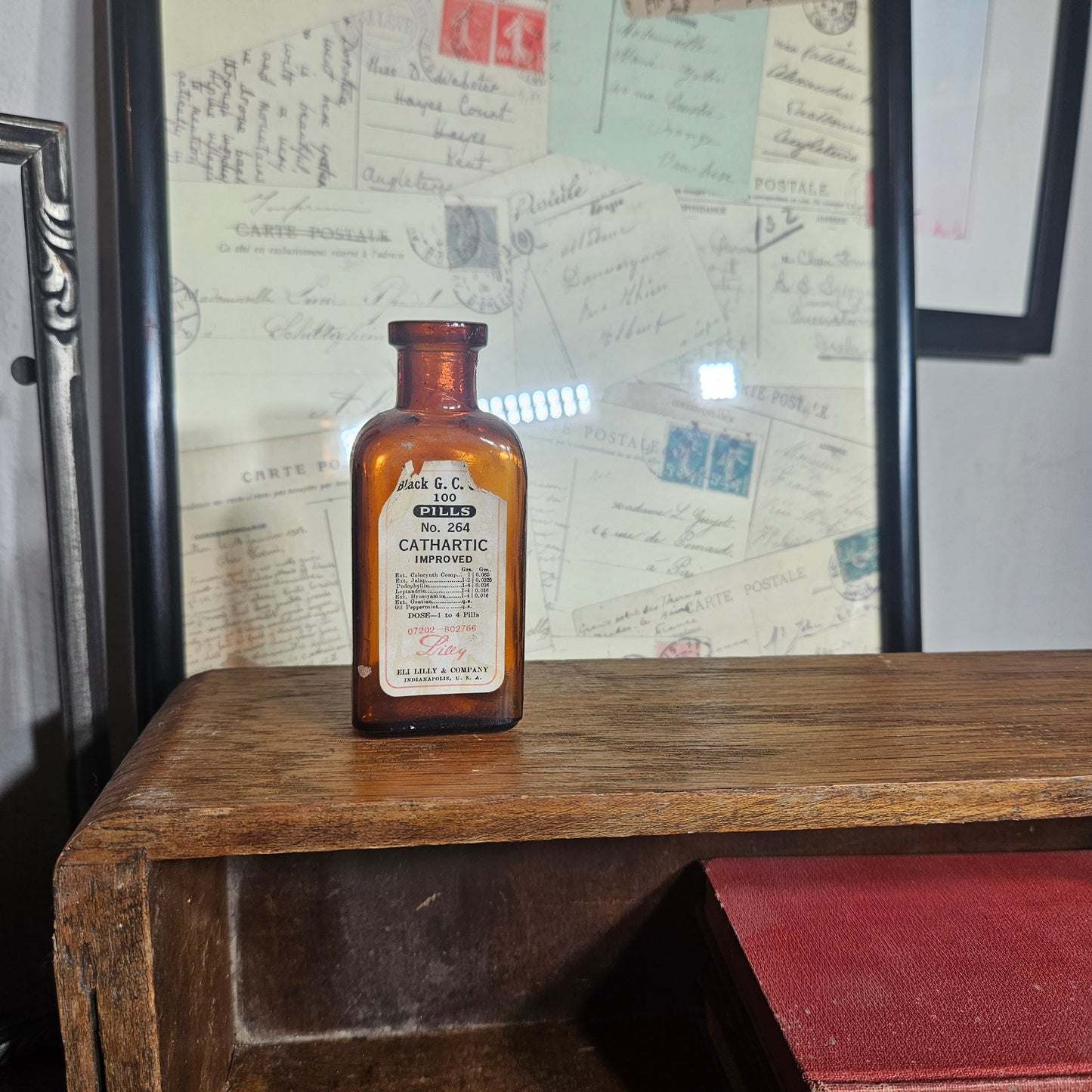 Small brown bottle with label on a wooden surface