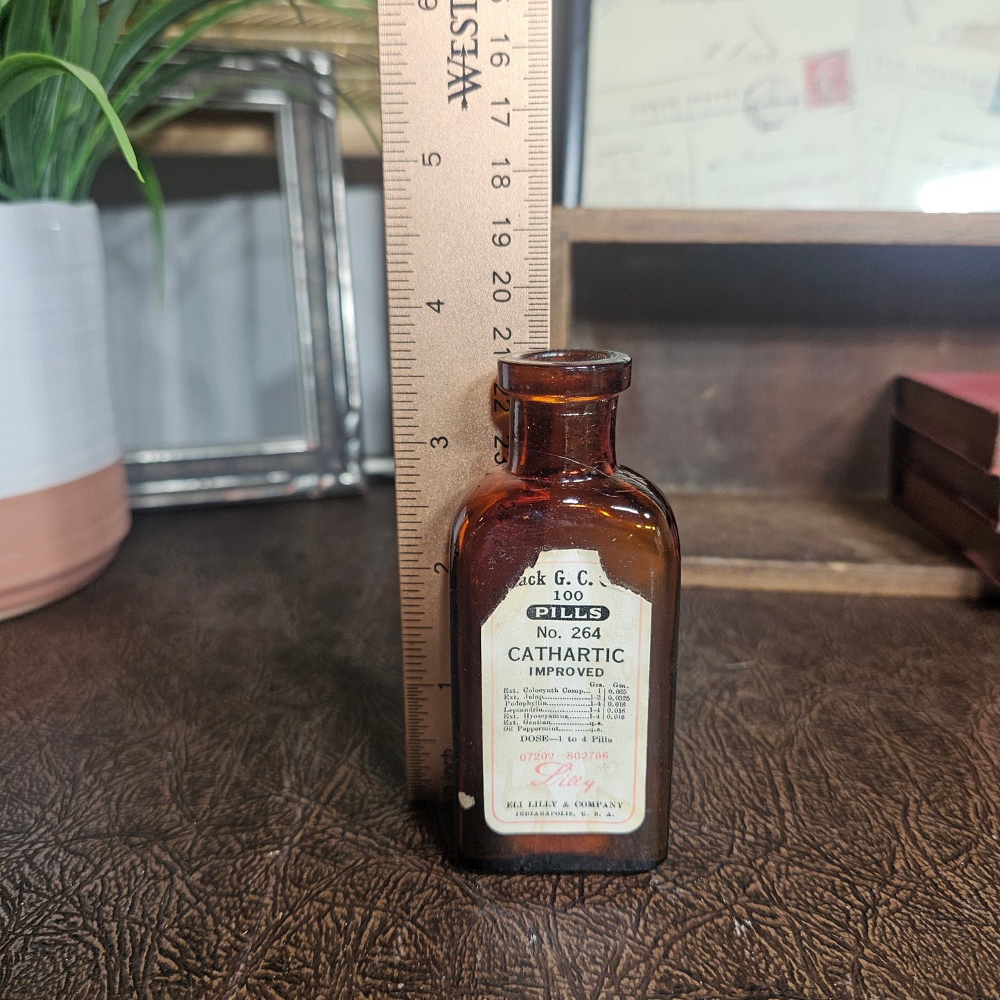 Small brown bottle with a label apothecary bottle