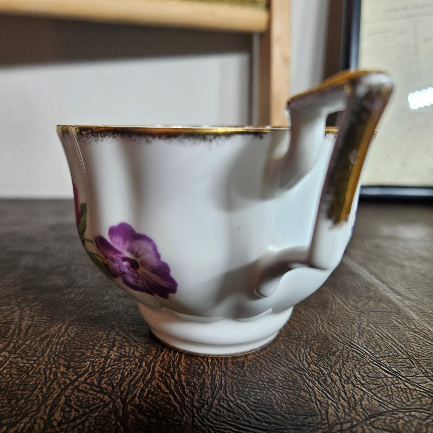 Foley bone china floral teacup with gold trim handle detail