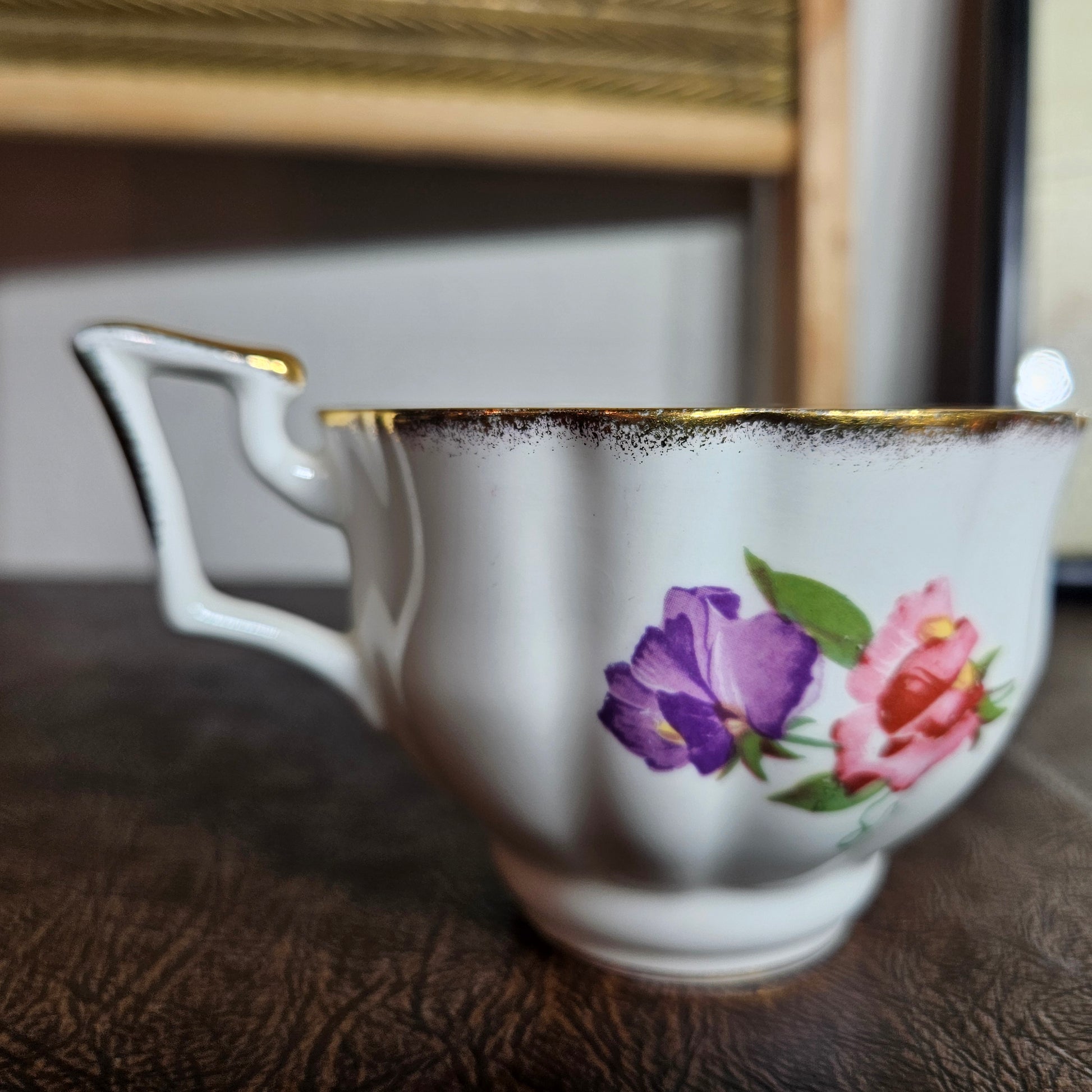 Foley bone china floral teacup with gold trim styled display