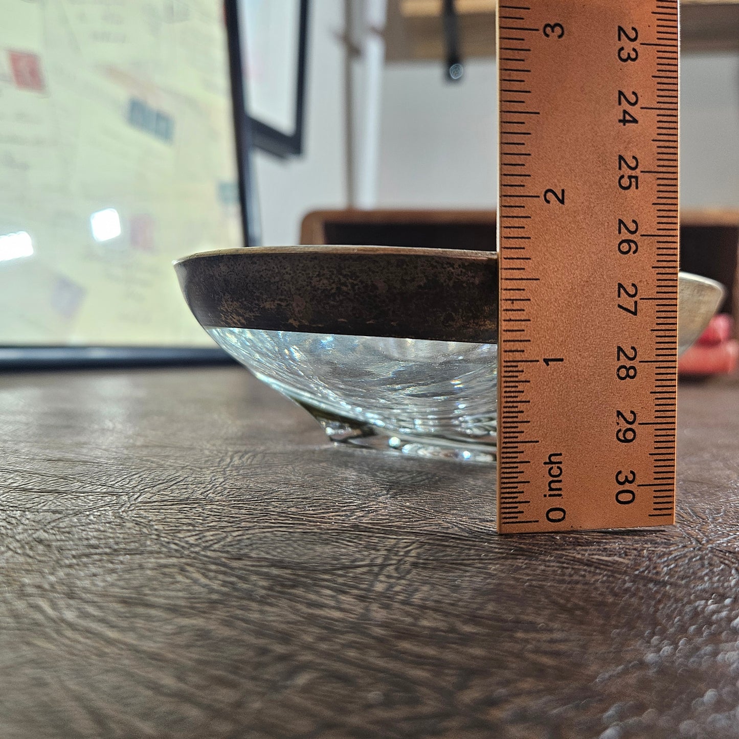 Glass serving dish with brass tone rim and raised center