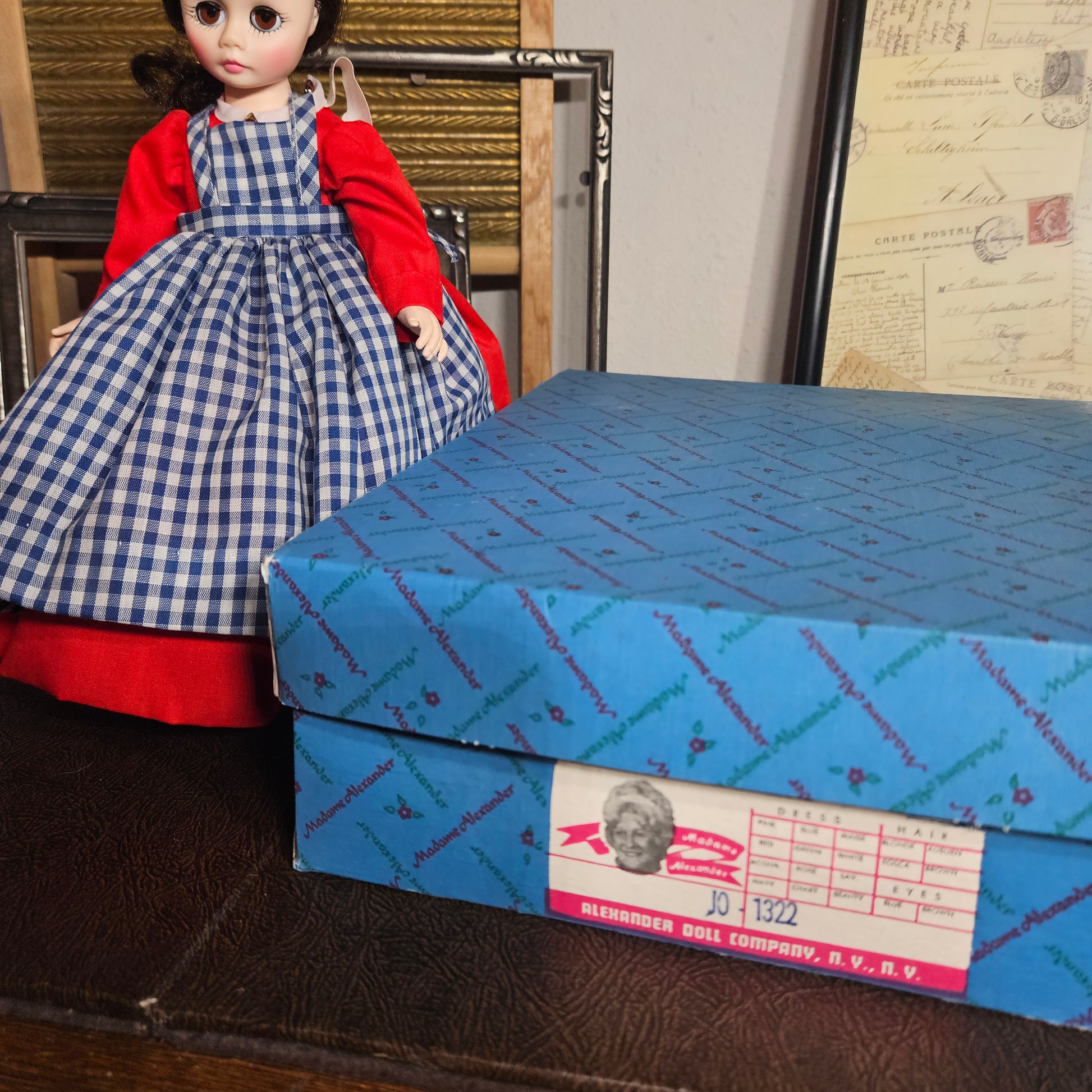Jo doll displayed beside original Madame Alexander box
