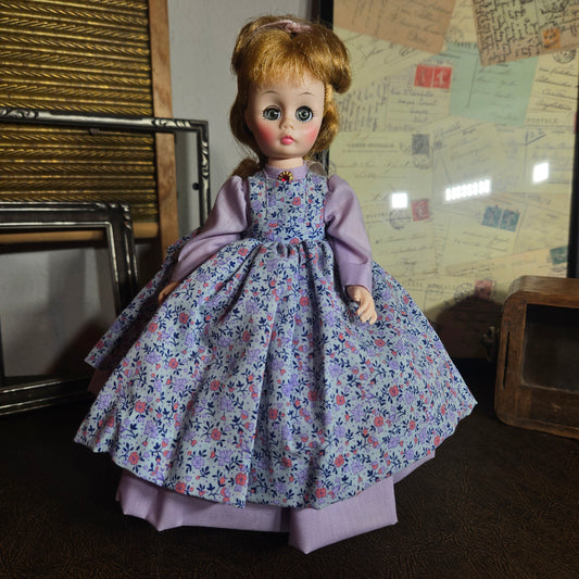 Madame Alexander Meg doll in purple floral dress
