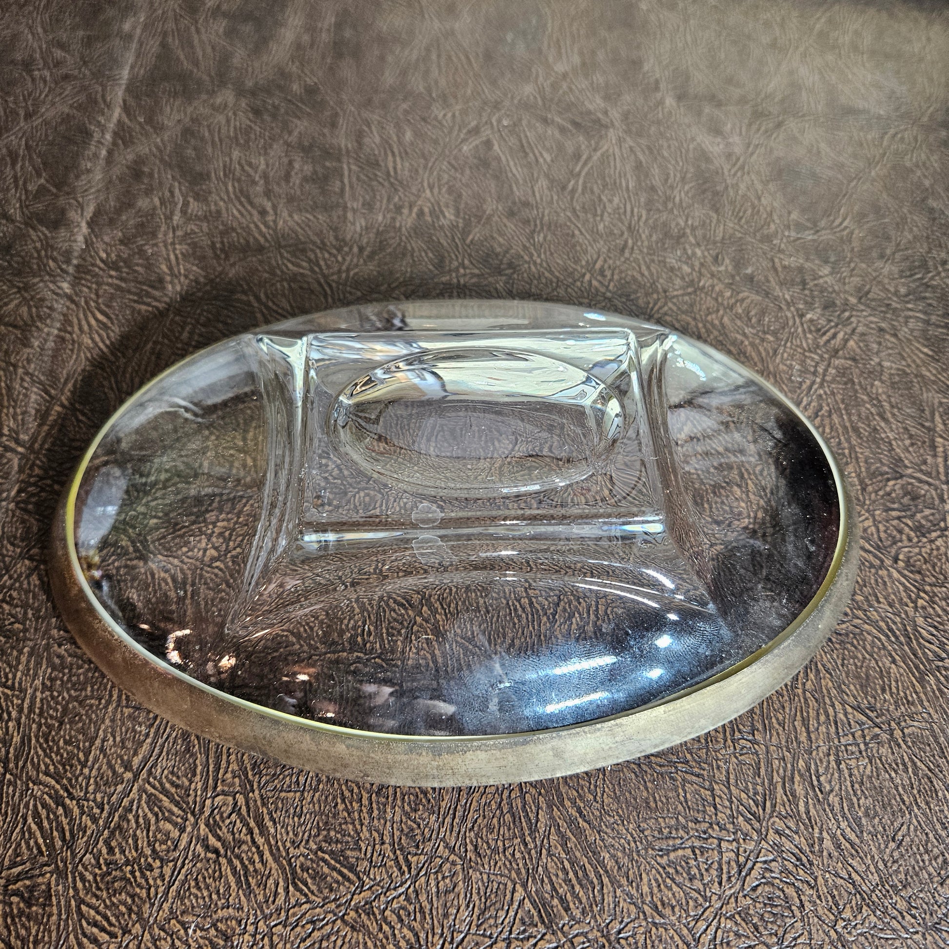 Mid-century glass serving piece with classic metal detail