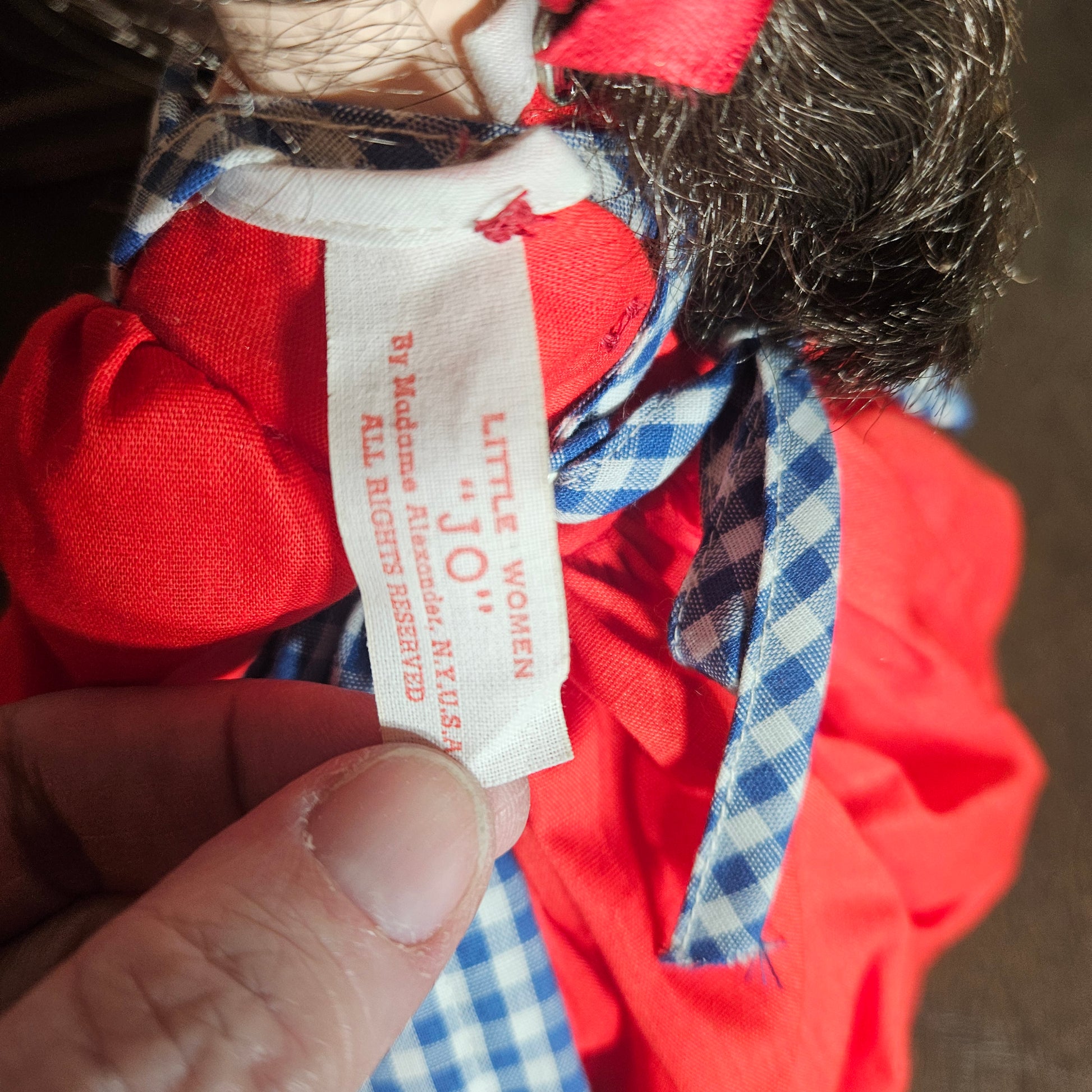 Madame Alexander doll in red dress
