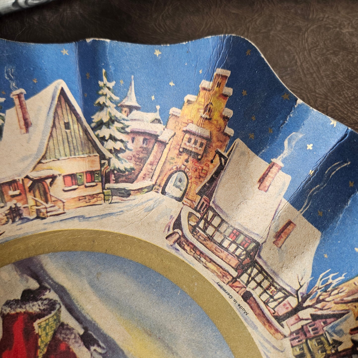 Retro paper Christmas platter featuring Santa and wintry details